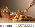 Baklava with walnuts and honey on a beige background. 135782231