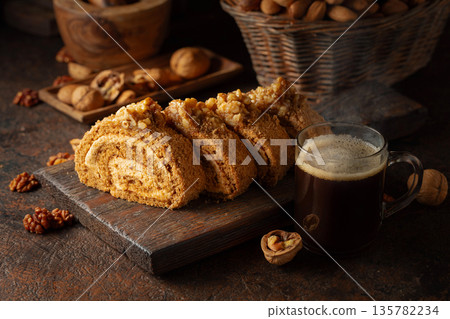 Walnut and buttercream roll: a traditional Oriental pastry. Walnut and buttercream roll: a traditional Oriental pastry. 135782234