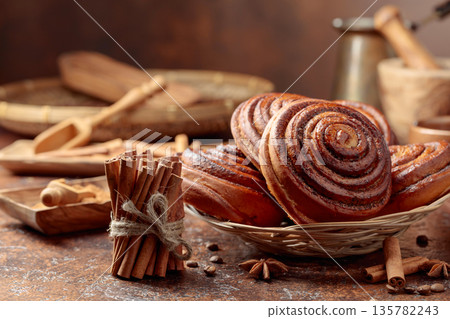 Freshly baked sweet cinnamon buns. 135782243
