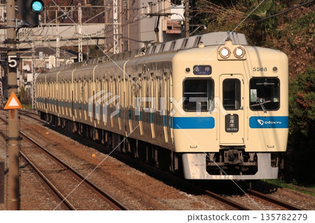 A local train of the 5200 series running on the Odakyu Line in the evening. Photo taken on December 20, 2010 A local train of the 5200 series running on the Odakyu Line in the evening. Photo taken on December 20, 2010 135782279