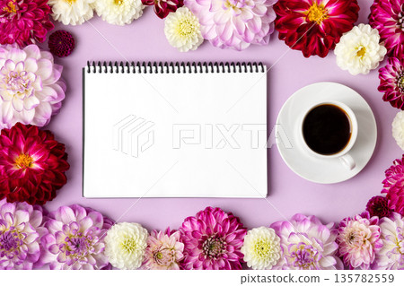 Composition with opened blank notepad, cup of black coffee, flowers dahlias on purple background. Festive office desktop concept. Morning coffee cup. Composition with opened blank notepad, cup of black coffee, flowers dahlias on purple background. Festive office desktop concept. Morning coffee cup. 135782559