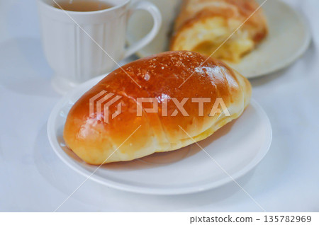 Shio Pan, Salzstangerl bread or Austria bread or Japanese bread with puff and hot tea 135782969