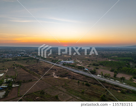 Aerial View of Rural Road at Golden Sunrise Aerial View of Rural Road at Golden Sunrise 135783151