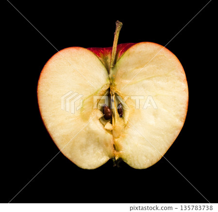 half of a ripe apple, isolated on a black background half of a ripe apple, isolated on a black background 135783738