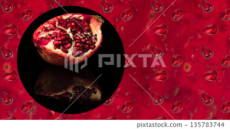 half ripe pomegranate fruit, on a black background in isolation, with reflection, place under the text on the flan of the peel and seeds of the pomegranate half ripe pomegranate fruit, on a black background in isolation, with reflection, place under the text on the flan of the peel and seeds of the pomegranate 135783744