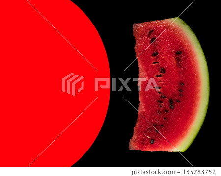 In the photo, a piece of ripe watermelon on a black background and a place for the text highlighted in red In the photo, a piece of ripe watermelon on a black background and a place for the text highlighted in red 135783752