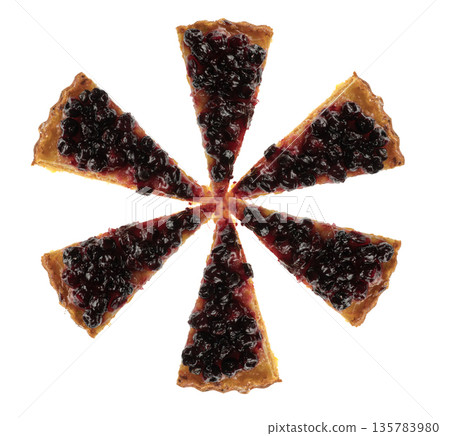 Cut into pieces carrot pie from above covered with currant berries, charlotte, on a white plate in isolation 135783980