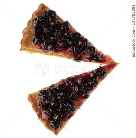 Cut into pieces carrot pie from above covered with currant berries, charlotte, on a white plate in isolation 135783981