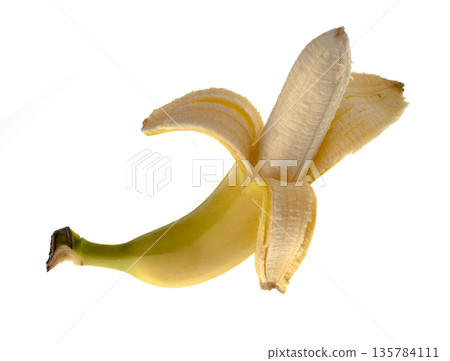 One Banana, half peeled, on a white background isolated One Banana, half peeled, on a white background isolated 135784111