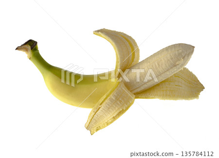 One ripe banana, half peeled, on a white background, isolated One ripe banana, half peeled, on a white background, isolated 135784112