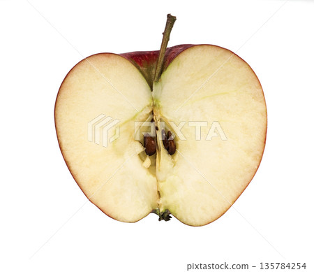 Sliced half of an apple, red filling, on a white background in isolation Sliced half of an apple, red filling, on a white background in isolation 135784254