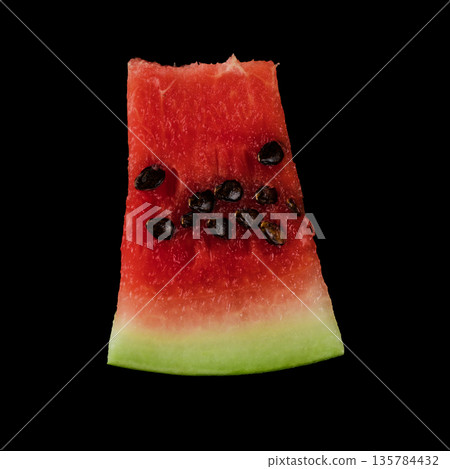 Piece of ripe watermelon on black background isolated 135784432