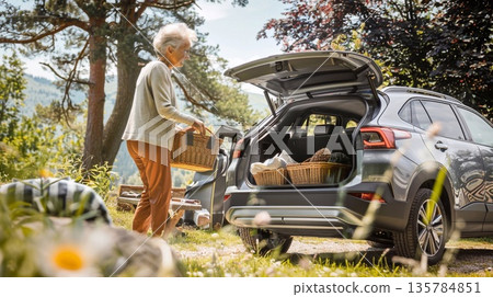 grandmother standing next to electric car, promote self-sufficiency, growing food and using renewable energy sources grandmother standing next to electric car, promote self-sufficiency, growing food and using renewable energy sources 135784851