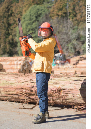 A Japanese man holding a chainsaw at the site. Photo courtesy of Tama Forest Center Cooperative Association. A Japanese man holding a chainsaw at the site. Photo courtesy of Tama Forest Center Cooperative Association. 135785771