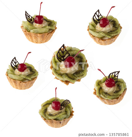 Dessert, cake with kiwi and cherries, on a white background in isolation, collage Dessert, cake with kiwi and cherries, on a white background in isolation, collage 135785861