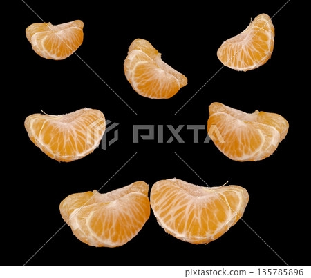 slices of ripe tangerines, on a black background, collage slices of ripe tangerines, on a black background, collage 135785896