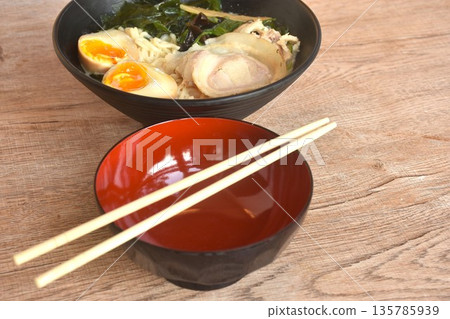 Tonkotsu Chashu ramen orJapanese yellow noodles topping slice braised pork with boiled egg and seaweed in Miso soy sauce on bowl Tonkotsu Chashu ramen orJapanese yellow noodles topping slice braised pork with boiled egg and seaweed in Miso soy sauce on bowl 135785939