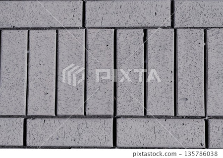 gray paving slabs lined in rows, texture, background 135786038