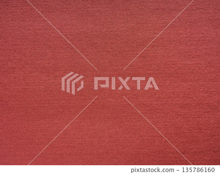Earthy terracotta tones blend seamlessly creating a serene and tactile paper texture 135786160