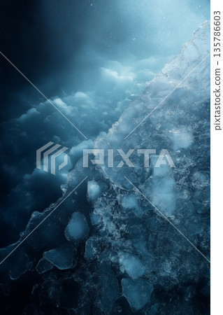 Blue ice background showing cold abstract texture. Cold blue ice shards forming an abstract textured frozen background Blue ice background showing cold abstract texture. Cold blue ice shards forming an abstract textured frozen background 135786603