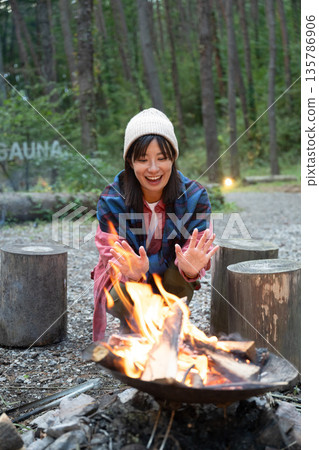 A woman enjoying the outdoors A woman enjoying the outdoors 135786906