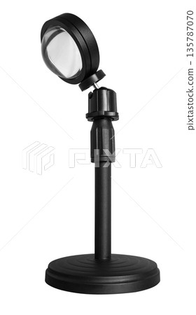Lamp illuminator on a tripod, on a white background in insulation Lamp illuminator on a tripod, on a white background in insulation 135787070