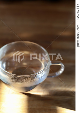 A cup of hot water to drink first thing in the morning 135787113