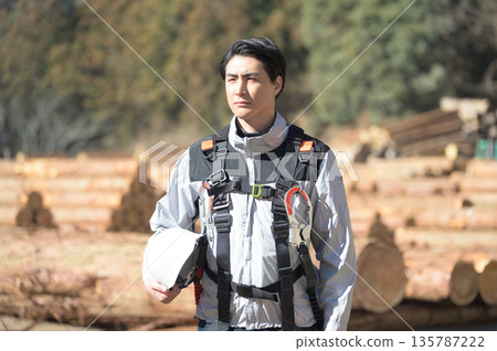 Profile of a Japanese man wearing work clothes Profile of a Japanese man wearing work clothes 135787222