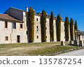 A large building with a lot of trees in front of it 135787254