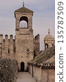A tall tower with a small window on the top 135787509