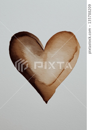 Brown watercolor heart creating organic abstract art. Brown heart shape painted with watercolor on textured white paper showing a drip Brown watercolor heart creating organic abstract art. Brown heart shape painted with watercolor on textured white paper showing a drip 135788209