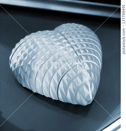Art model printed on 3D printer from molten plastic. Object created on 3D printer. Form printed on 3D printer from blue plastic. Concept 3D printing technology. Additive progressive FDM technologies Art model printed on 3D printer from molten plastic. Object created on 3D printer. Form printed on 3D printer from blue plastic. Concept 3D printing technology. Additive progressive FDM technologies 135788491
