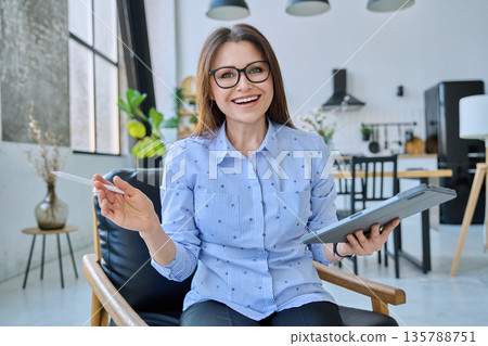 Webcam view woman entrepreneur, teacher working online remotely in home office 135788751