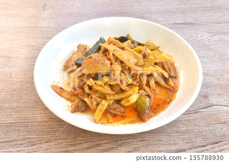 spicy stir fried bamboo shoot and chicken with curry on plate spicy stir fried bamboo shoot and chicken with curry on plate 135788930