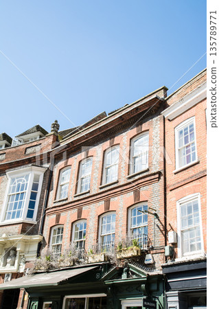 Historic red brick buildings under bright sunlight in Windsor, a suburb of London Historic red brick buildings under bright sunlight in Windsor, a suburb of London 135789771
