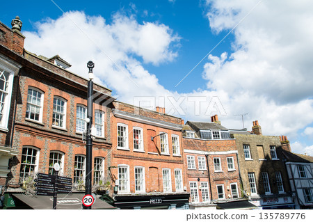 Historic red brick buildings under bright sunlight in Windsor, a suburb of London 135789776