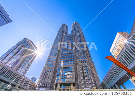 Tokyo cityscape in Japan: A view of the Tokyo Metropolitan Government Building, sunlight, business districts, and more... a ray of hope... = January 25, 2026 135790395