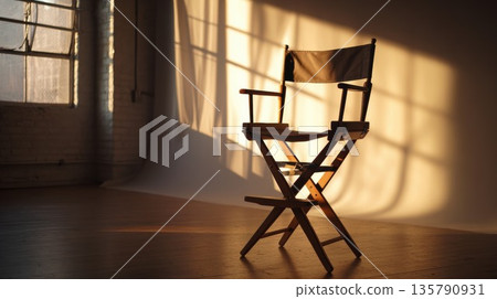 Director's chair sits in a sunlit film studio during golden hour Director's chair sits in a sunlit film studio during golden hour 135790931