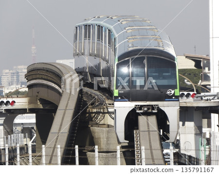 Tokyo Monorail running along a curved track and Tokyo Tower in winter Tokyo Monorail running along a curved track and Tokyo Tower in winter 135791167