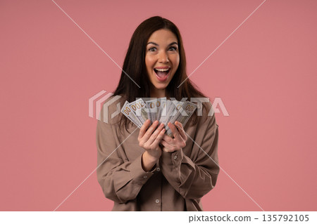 Rich Happy Woman Waving Usd Cash Money Dollars As Fan On Pink, Income Payment 135792105
