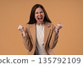 Angry Woman Yelling At Camera With Expressive Face, Raised Hand In Frustration 135792109