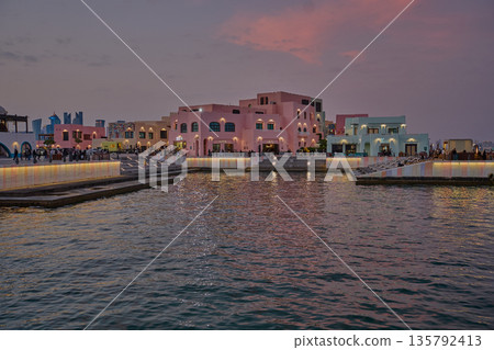 Doha, Qatar - January 19 2026: Old Doha port (Mina District) sunset shot showing cafe and restaurants  with locals and visitors walking 135792413