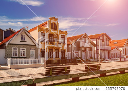 Costa Nova, Aveiro, Portugal: colorful striped houses called Palheiros at street Costa Nova, Aveiro, Portugal: colorful striped houses called Palheiros at street 135792978