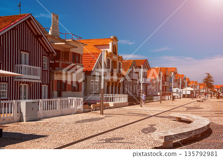 Costa Nova, Aveiro, Portugal: colorful striped houses called Palheiros at street Costa Nova, Aveiro, Portugal: colorful striped houses called Palheiros at street 135792981
