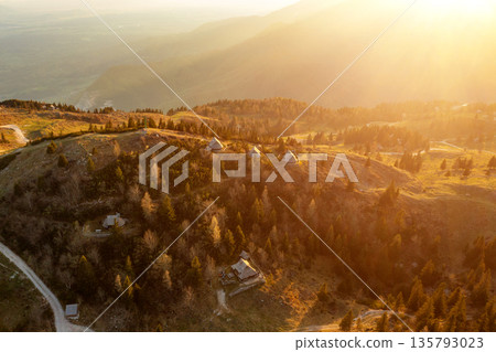 Mountain village in Alps, wooden houses at sunset, Velika Planina, Kamnik, Slovenia 135793023