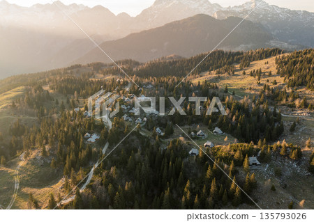 Mountain village in Alps, wooden houses at sunset, Velika Planina, Kamnik, Slovenia 135793026