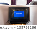 Announcement in Progress disruption message on inflight entertainment screen in business class 135793166
