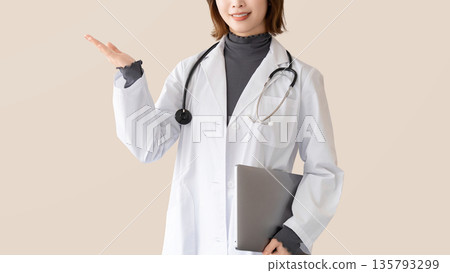 Smiling female medical staff guiding 135793299