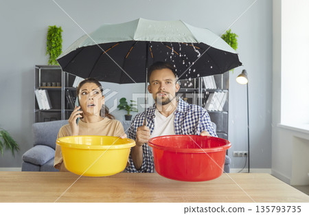 Phone call to repair service from woman, problem of couple due to roof damage, water leaking Phone call to repair service from woman, problem of couple due to roof damage, water leaking 135793735