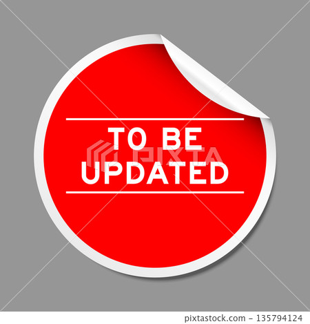 Red color peel sticker label with word to be updated on gray background Red color peel sticker label with word to be updated on gray background 135794124